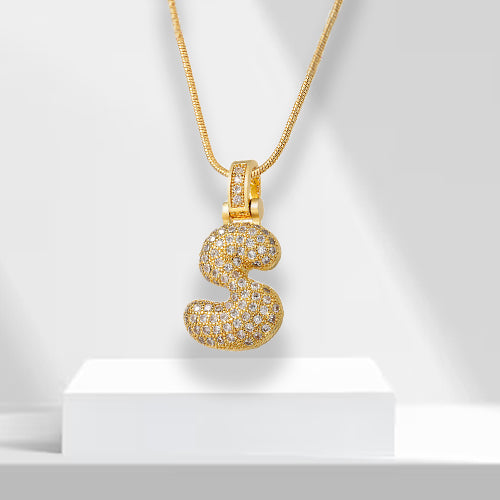 Shimmering zirconia bubble letter pendant, gold plated and perfect as a women's statement necklace.