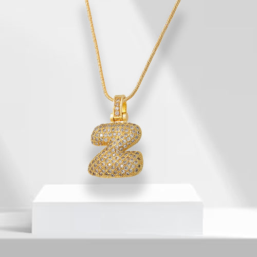 Versatile gold plated bubble letter necklace for women, adorned with zirconia. A stylish gift.