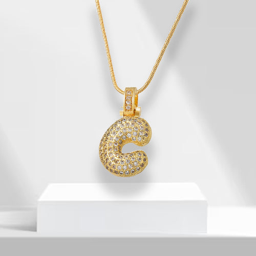 Fashionable gold plated bubble letter pendant necklace for women, adorned with brilliant zirconia. Perfect gift.