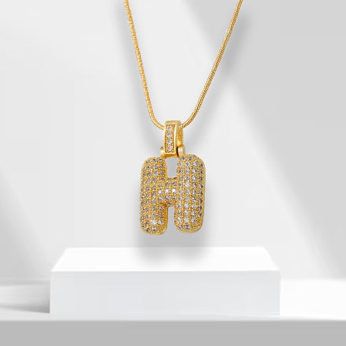 Statement bubble letter 'M' necklace for women, gold plated with brilliant zirconia. Glamorous jewelry.