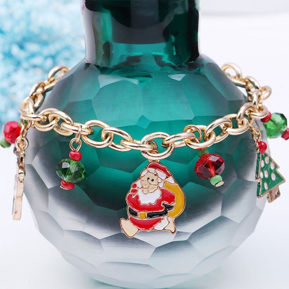Stylish women's Christmas bracelet, a gold-plated charm accessory with dazzling rhinestones for holiday parties.
