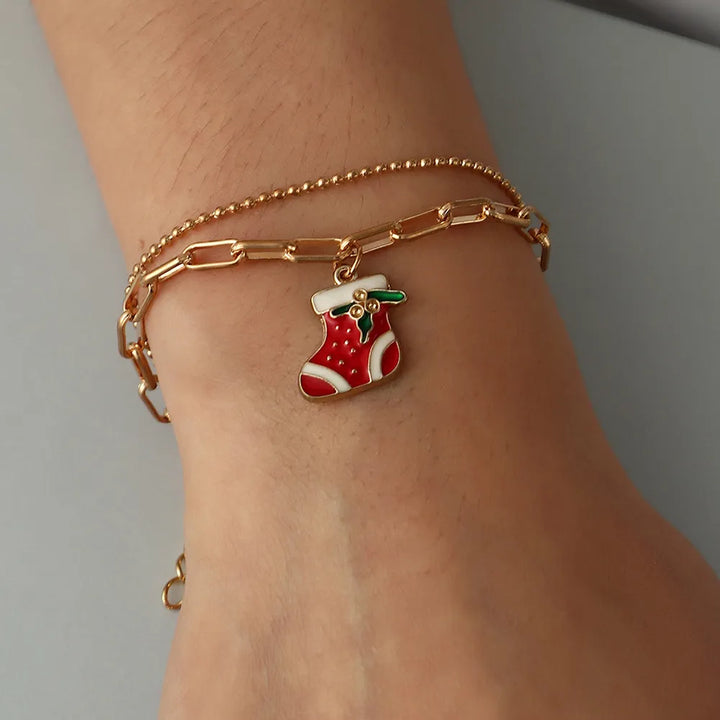 Adjustable gold-plated Christmas charm bracelet, ideal holiday jewelry gift for her.