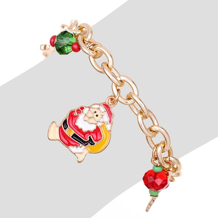Gift for her: Festive gold-plated women's Christmas charm bracelet, sparkling with rhinestones, ideal for holidays.
