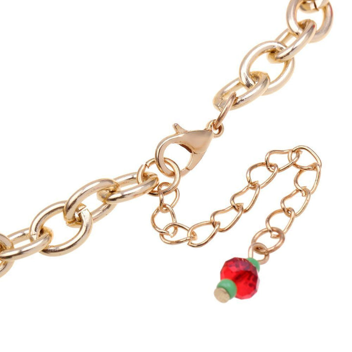 Seasonal style: Women's gold-plated Christmas charm bracelet with festive elements & shiny rhinestones.