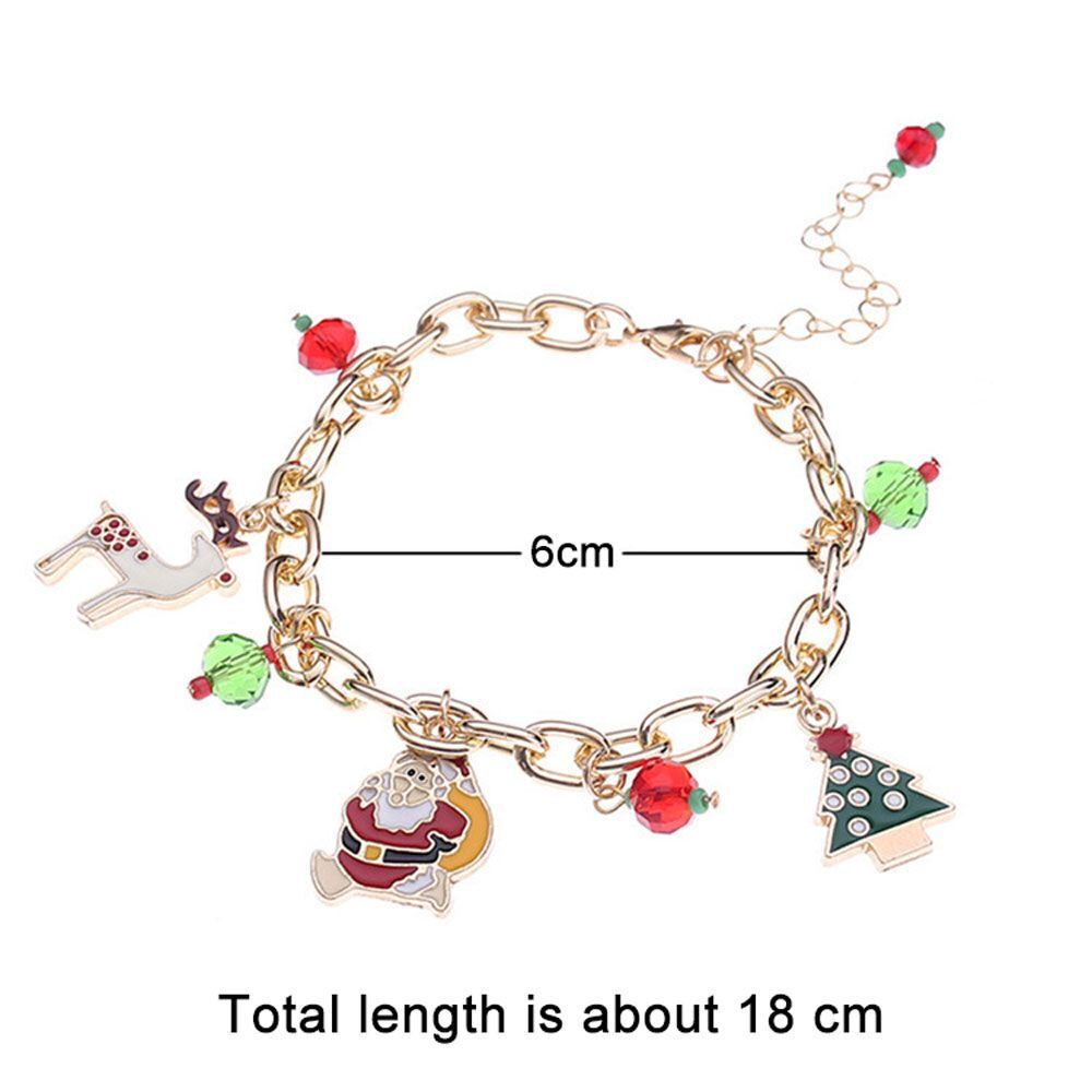 Delicate women's holiday jewelry: Gold-plated Christmas charm bracelet, perfect for a festive accessory look.