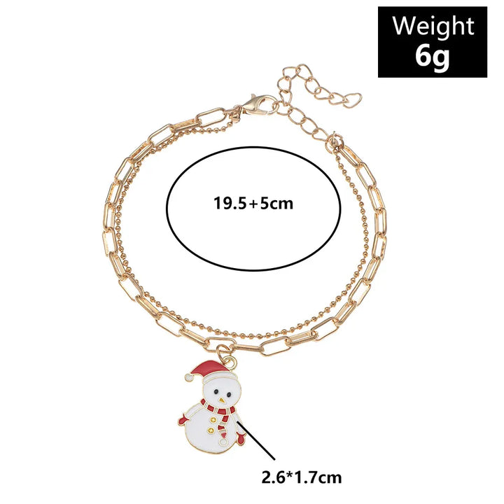 Elegant gold-plated Christmas charm bracelet for women, with colorful holiday enamel charms.