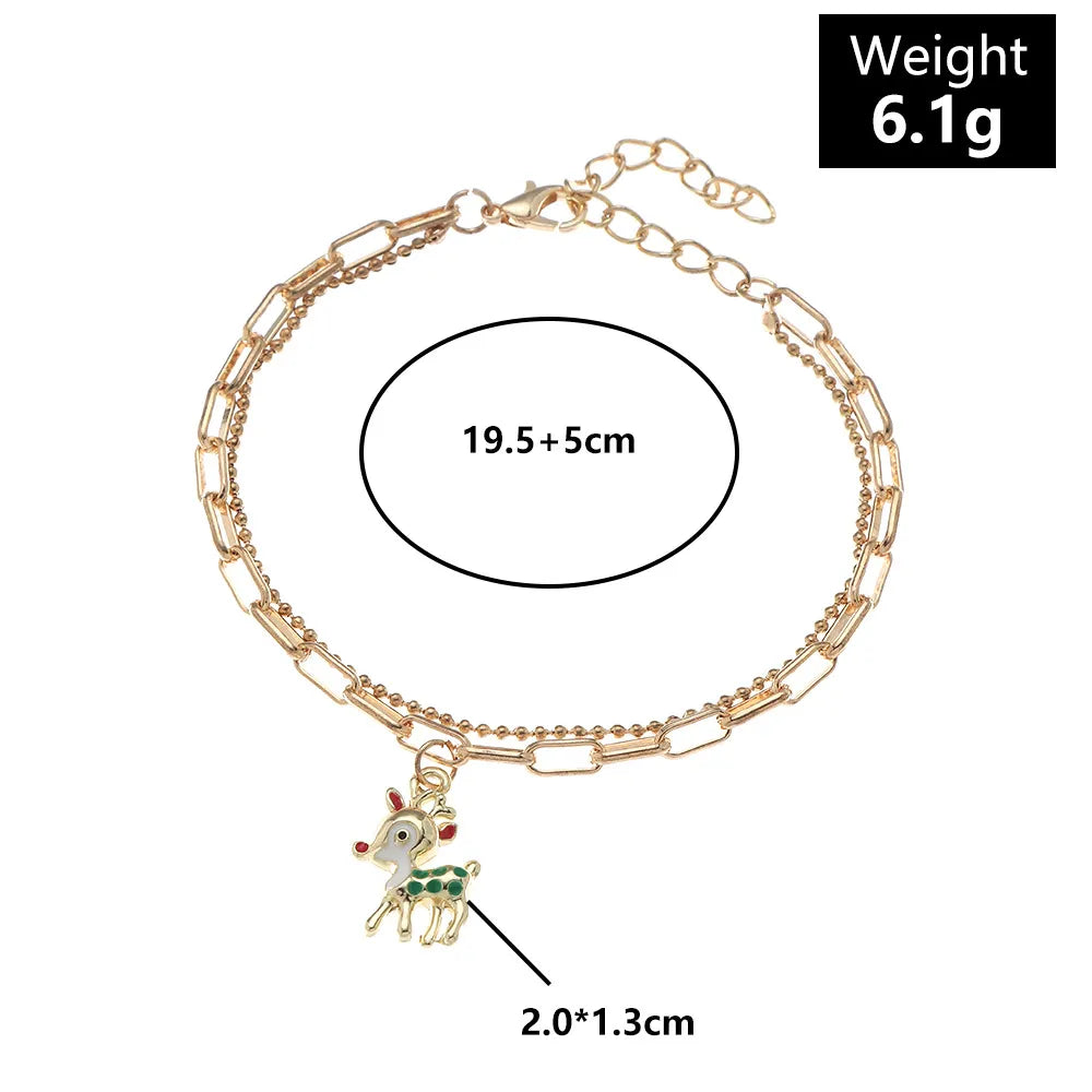Adjustable women's gold-plated charm bracelet featuring unique Christmas enamel designs.