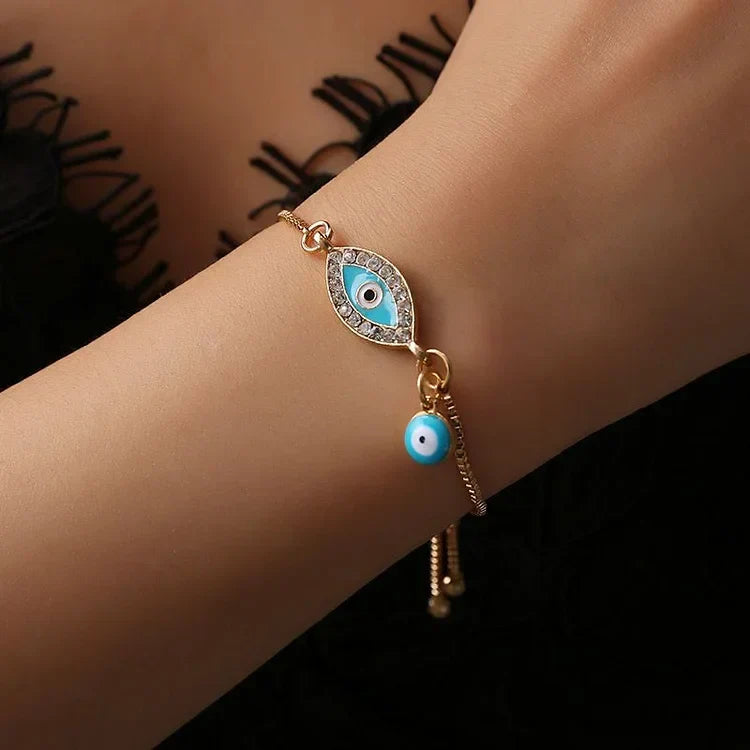 Elegant women's evil eye protection bracelet, gold plated & sparkling, ideal spiritual gift in an ethnic boho style.