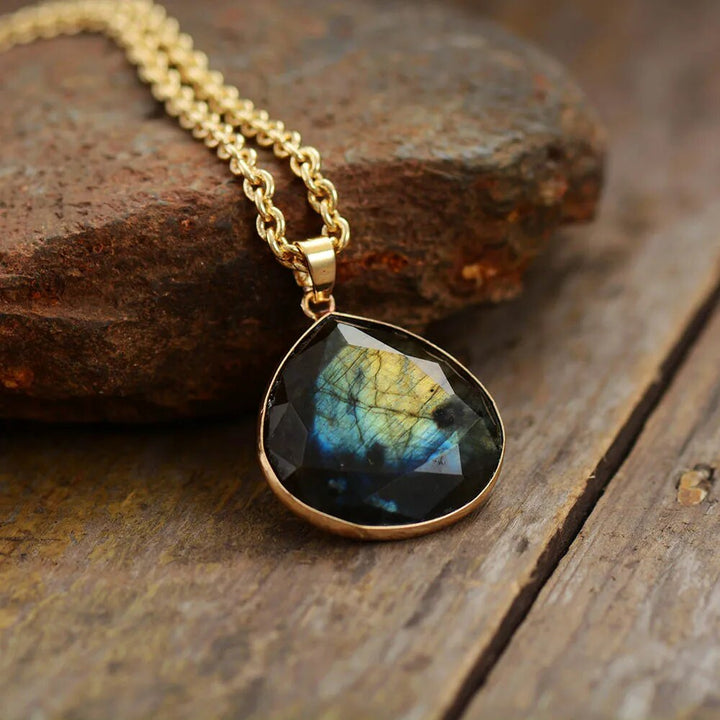 Women's gold plated labradorite drop necklace. Elegant boho gemstone pendant for spiritual protection.