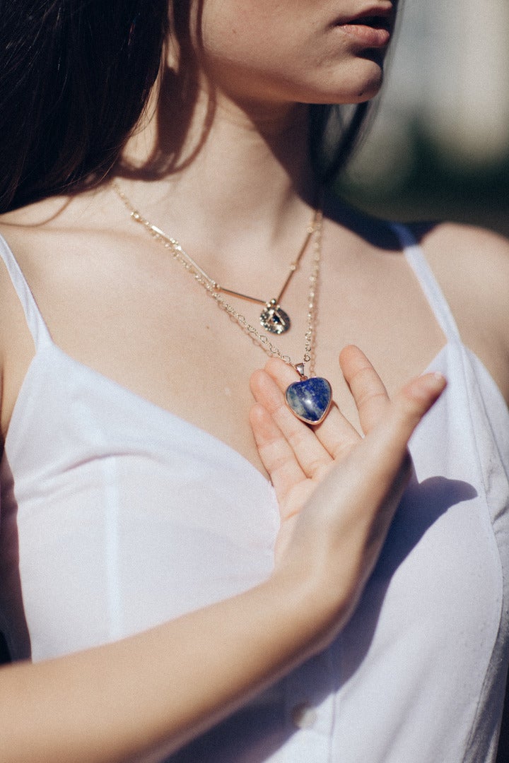 Gold plated Lapis Lazuli necklace for women. Features genuine Lapis gemstone and an Eye of Providence charm.