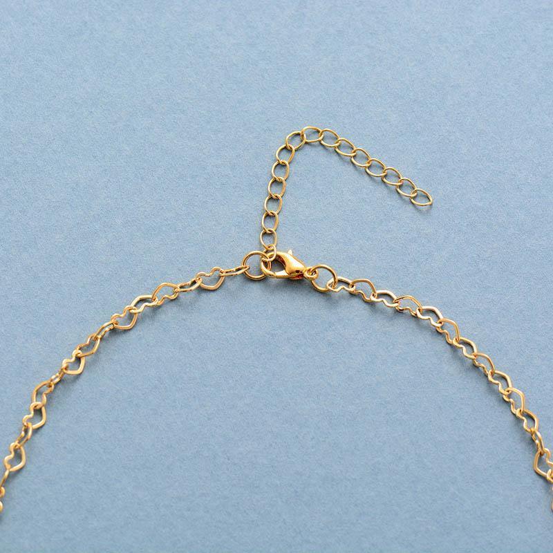 Close-up of a Women's gold-plated Lapis Lazuli necklace, with a smooth blue gemstone and delicate chain.