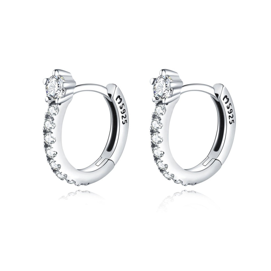 Women's gold plated radiant sparkle hoop earrings with dazzling zirconia. Perfect dainty fashion jewelry.