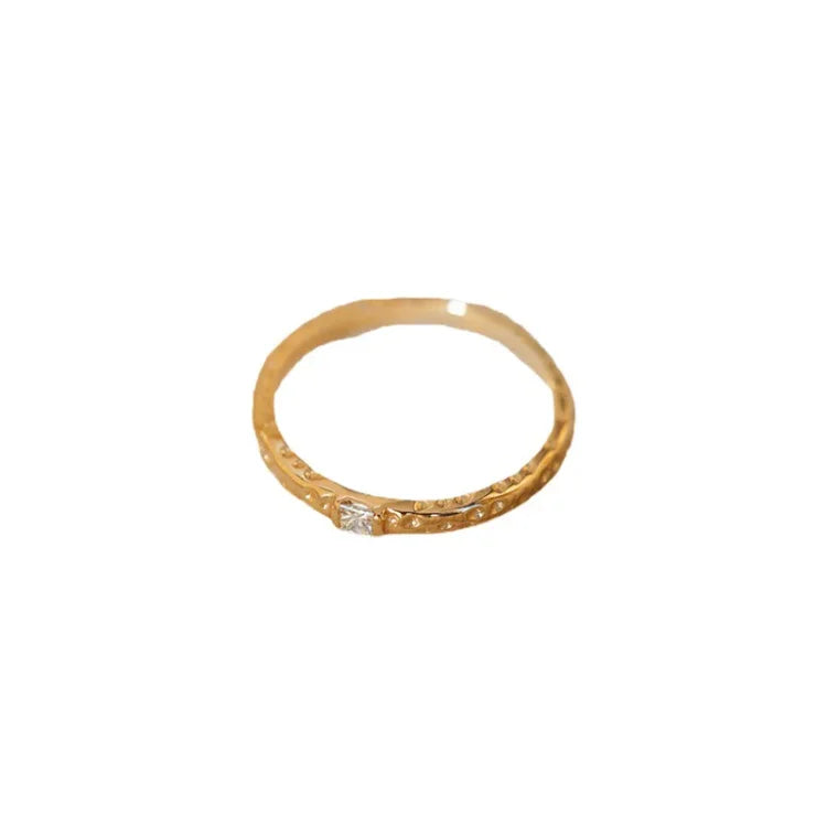 Women's gold plated sterling silver Aurora ring with sparkling zirconia stones, perfect for elegant everyday wear.
