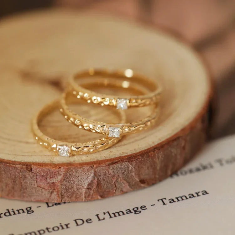 Elegant women's gold plated sterling silver ring adorned with shimmering zirconia stones, suitable for any occasion.