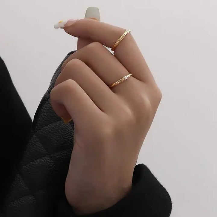Aurora women's gold plated sterling silver ring, featuring brilliant zirconia stones, a delicate and stackable design.