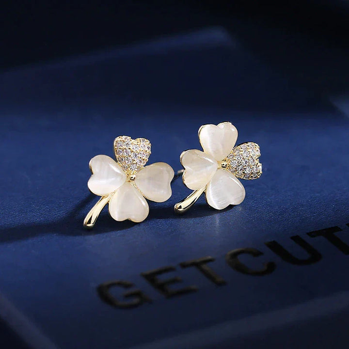 Women's gold-plated sterling silver four-leaf clover drop earrings. Elegant lucky charm jewelry, hypoallergenic.