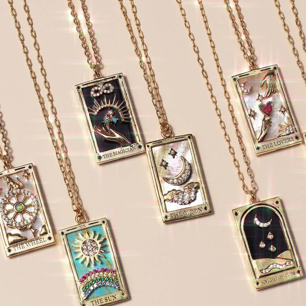 Women's gold-plated tarot card drop pendant necklace with shimmering zirconia.