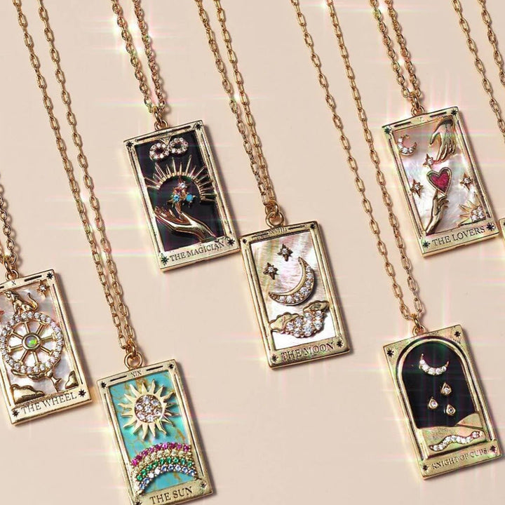 Women's gold-plated tarot card drop pendant necklace with shimmering zirconia.
