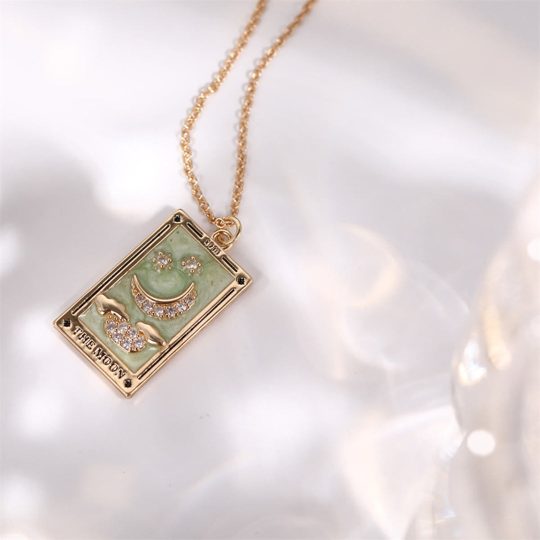A unique gold-plated tarot card drop necklace, spiritual accessory for stylish women.