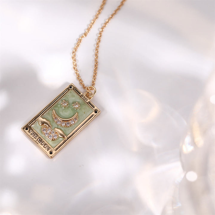 A unique gold-plated tarot card drop necklace, spiritual accessory for stylish women.