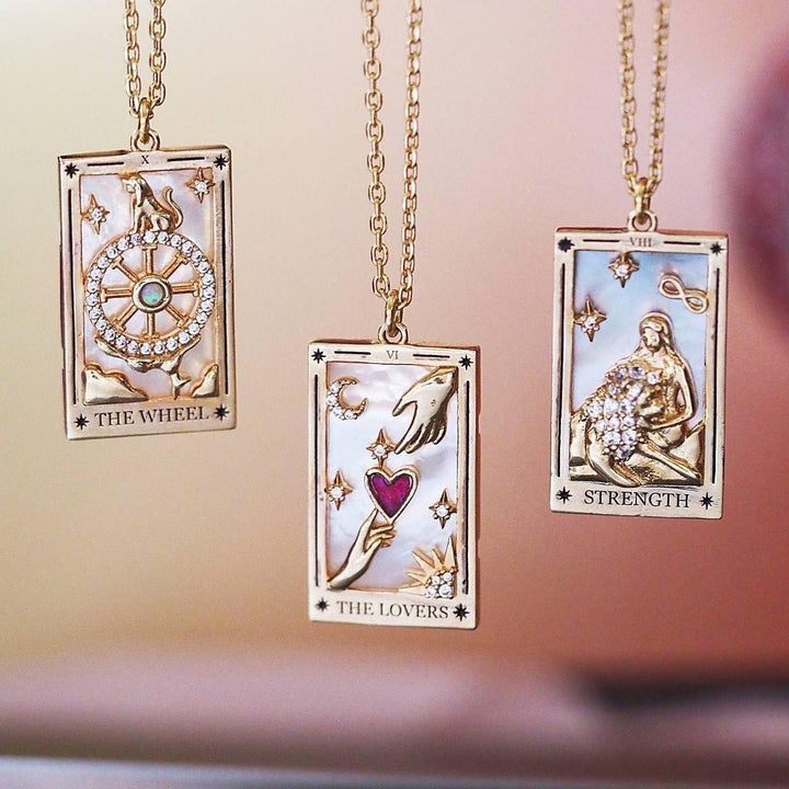 Unique women's gold-plated tarot card pendant necklace, an elegant fashion statement.