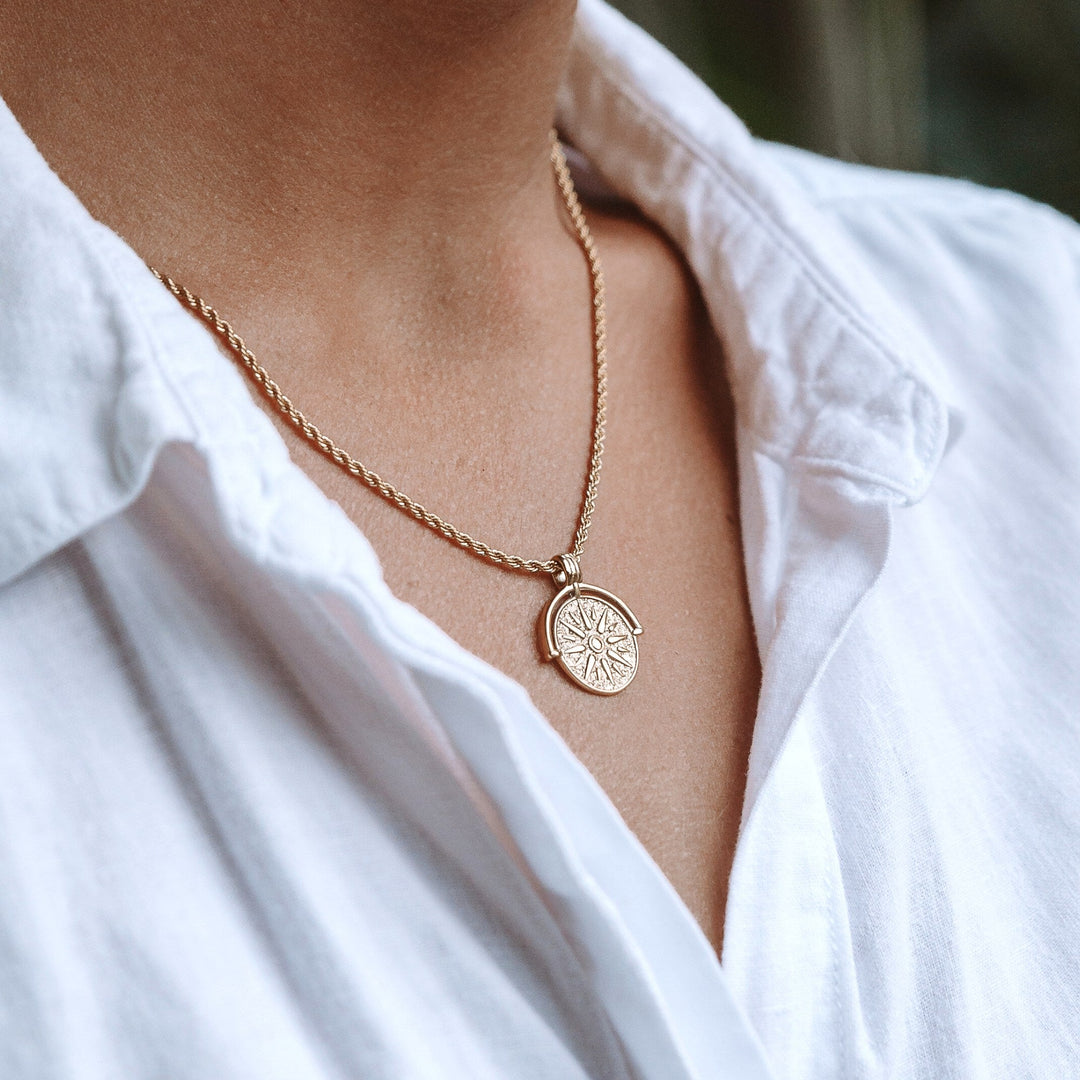Water resistant silver sun pendant, women's minimalist everyday wear jewelry.