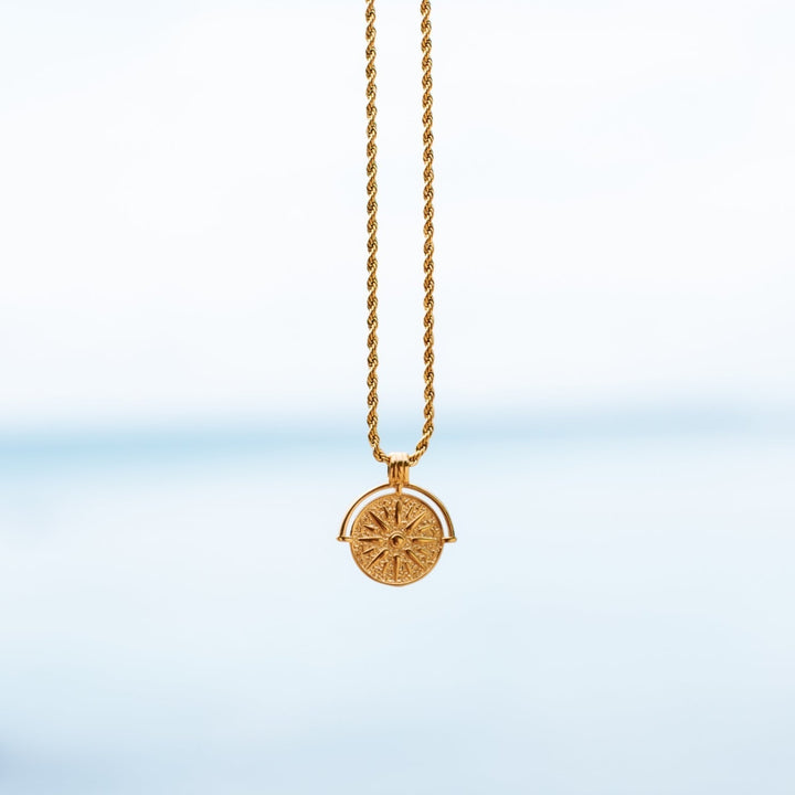 Radiant sun pendant necklace in gold, women's elegant celestial jewelry.