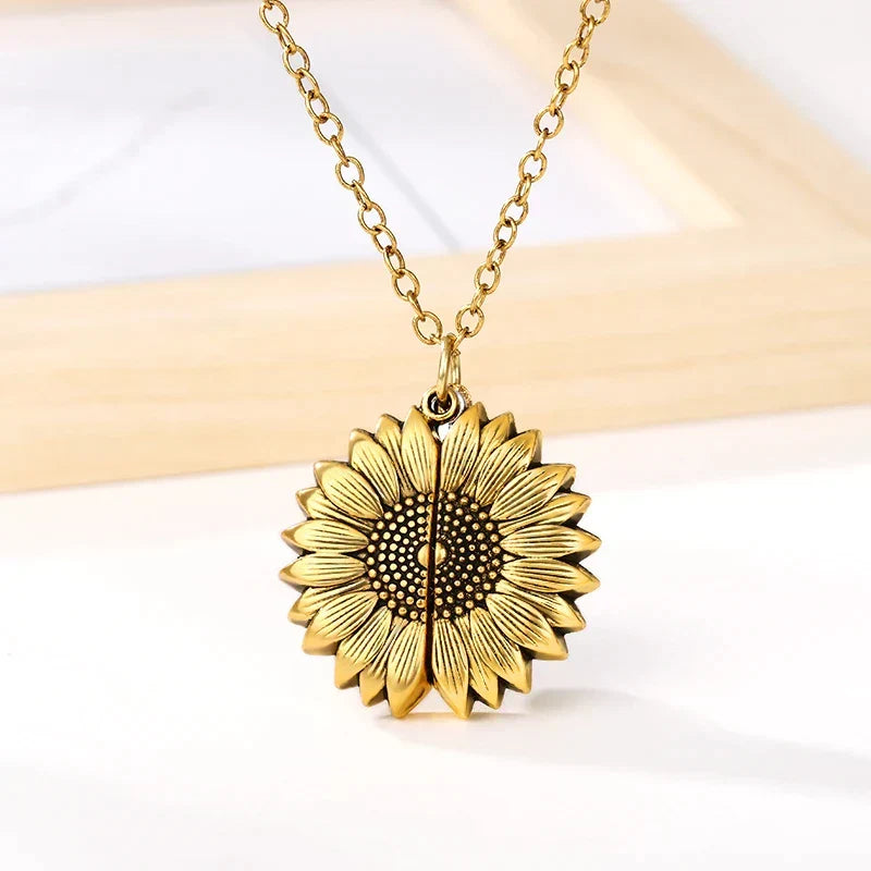 Adjustable gold tone sunflower locket necklace, 'You're My Sunshine' message, perfect women's gift.
