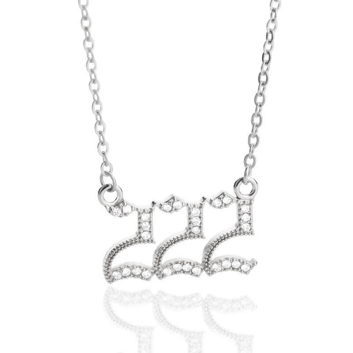 Stainless steel angel numbers pendant necklace for a woman's spiritual journey.