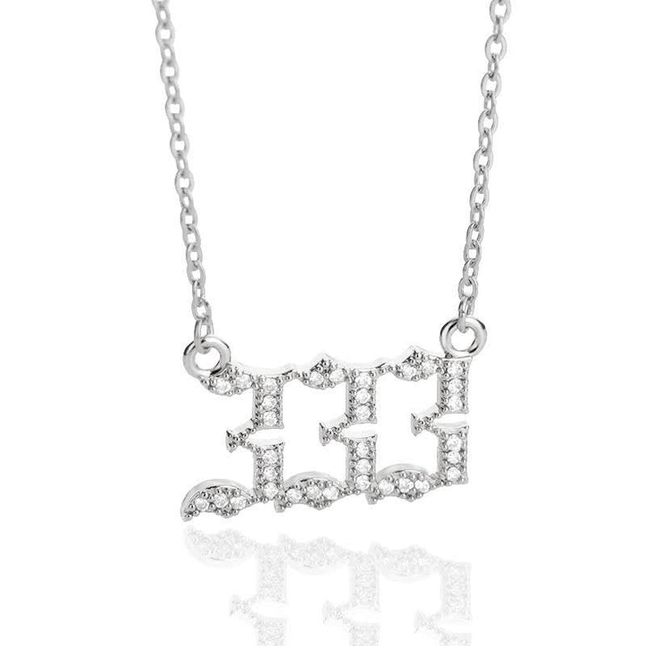 Chic women's gold zirconia angel numbers necklace, a symbol of protection.