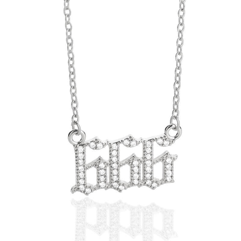 Close-up of a delicate silver zirconia angel numbers protection necklace.