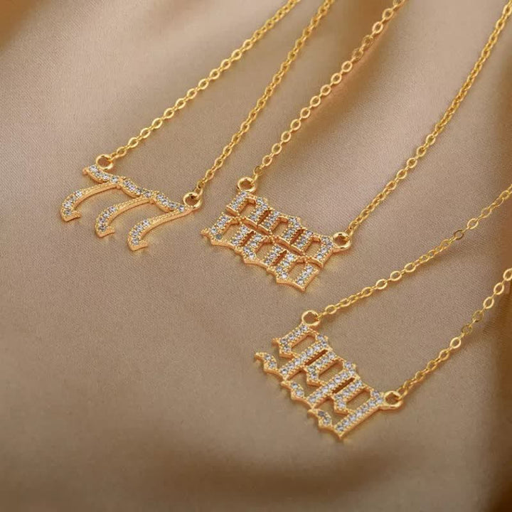 Close-up of a women's stainless steel angel numbers talisman necklace.