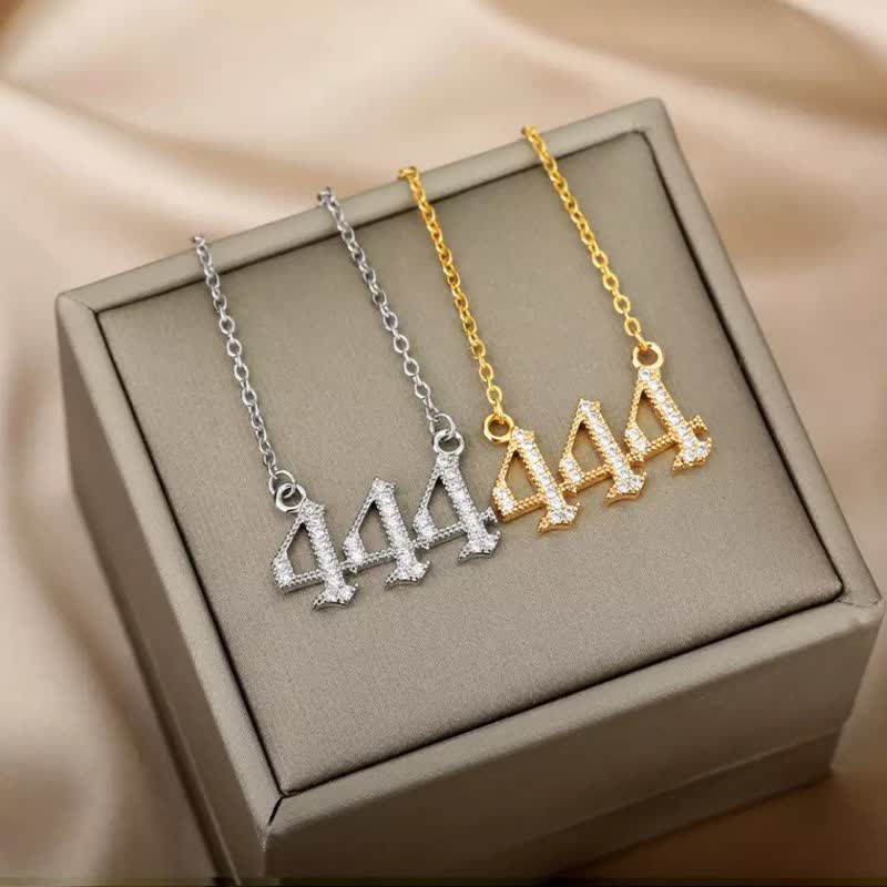 Delicate silver pendant necklace featuring dazzling zirconia angel numbers.