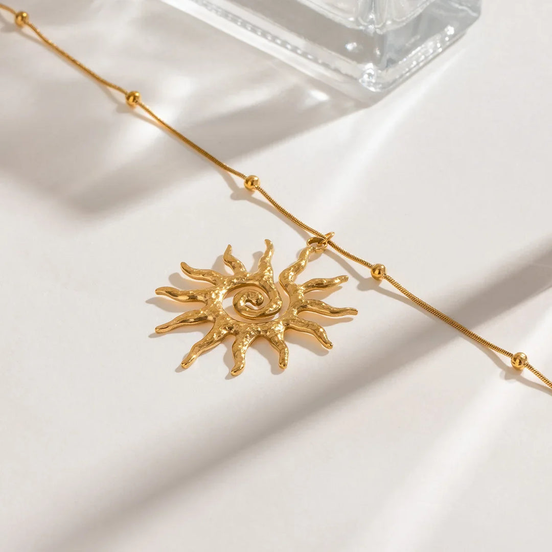 Bohemian-inspired golden hammered sun pendant necklace, a perfect elegant gift for women.