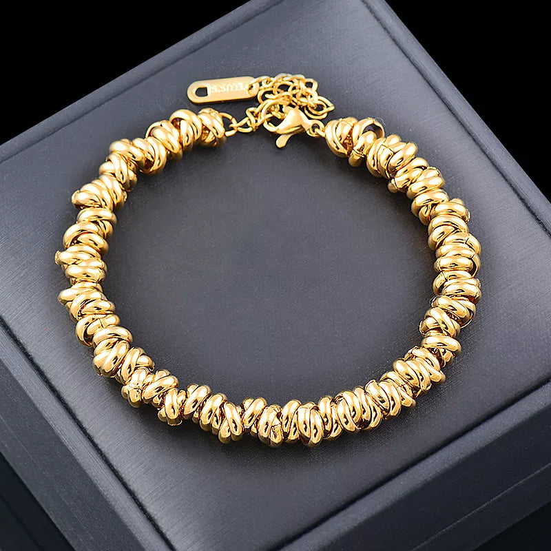 Women's golden pearl bracelet, featuring elegant chain detailing. Perfect fashion jewelry for classic style.