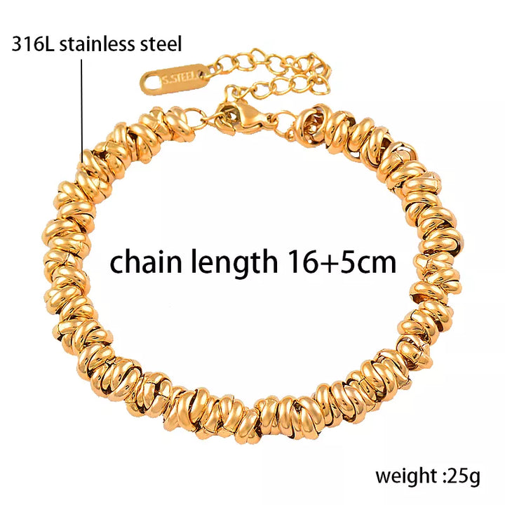 Elegant women's golden pearl bracelet featuring a unique tricolor chain. A stylish fashion accessory.