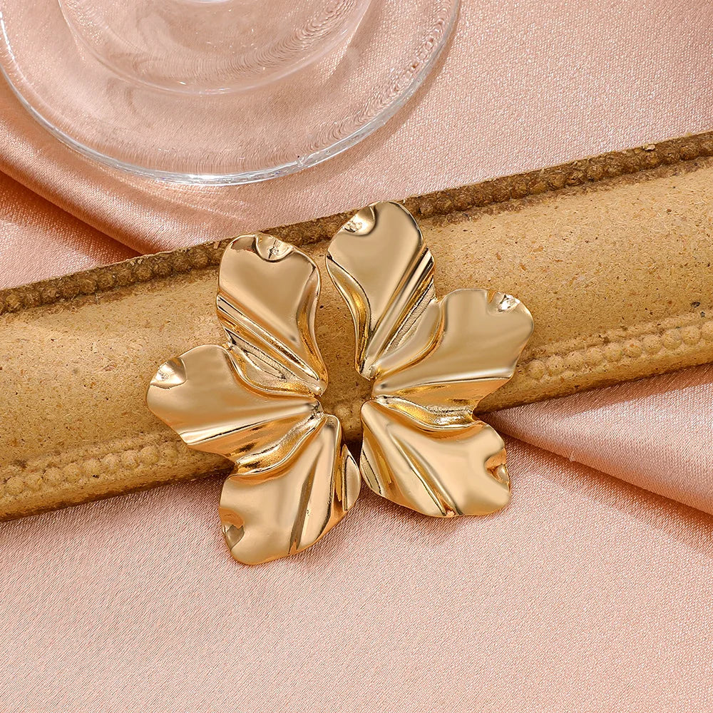 Beautiful women's golden petal stud earrings, elegant floral design gift.