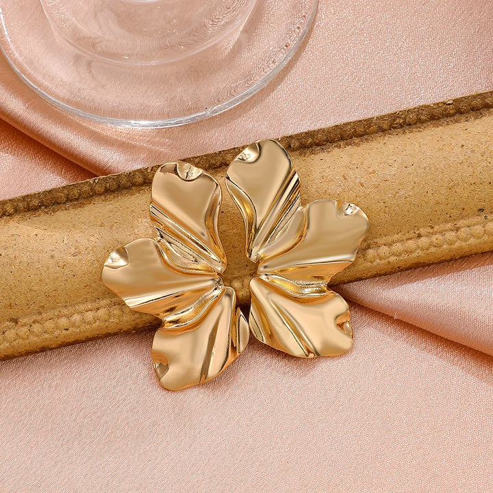 Beautiful women's golden petal stud earrings, elegant floral design gift.