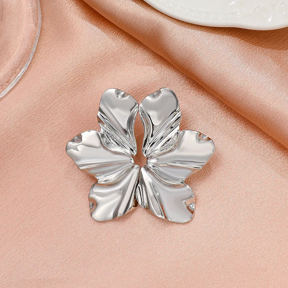 Stylish women's golden petal stud earrings, elegant floral design for fashion.
