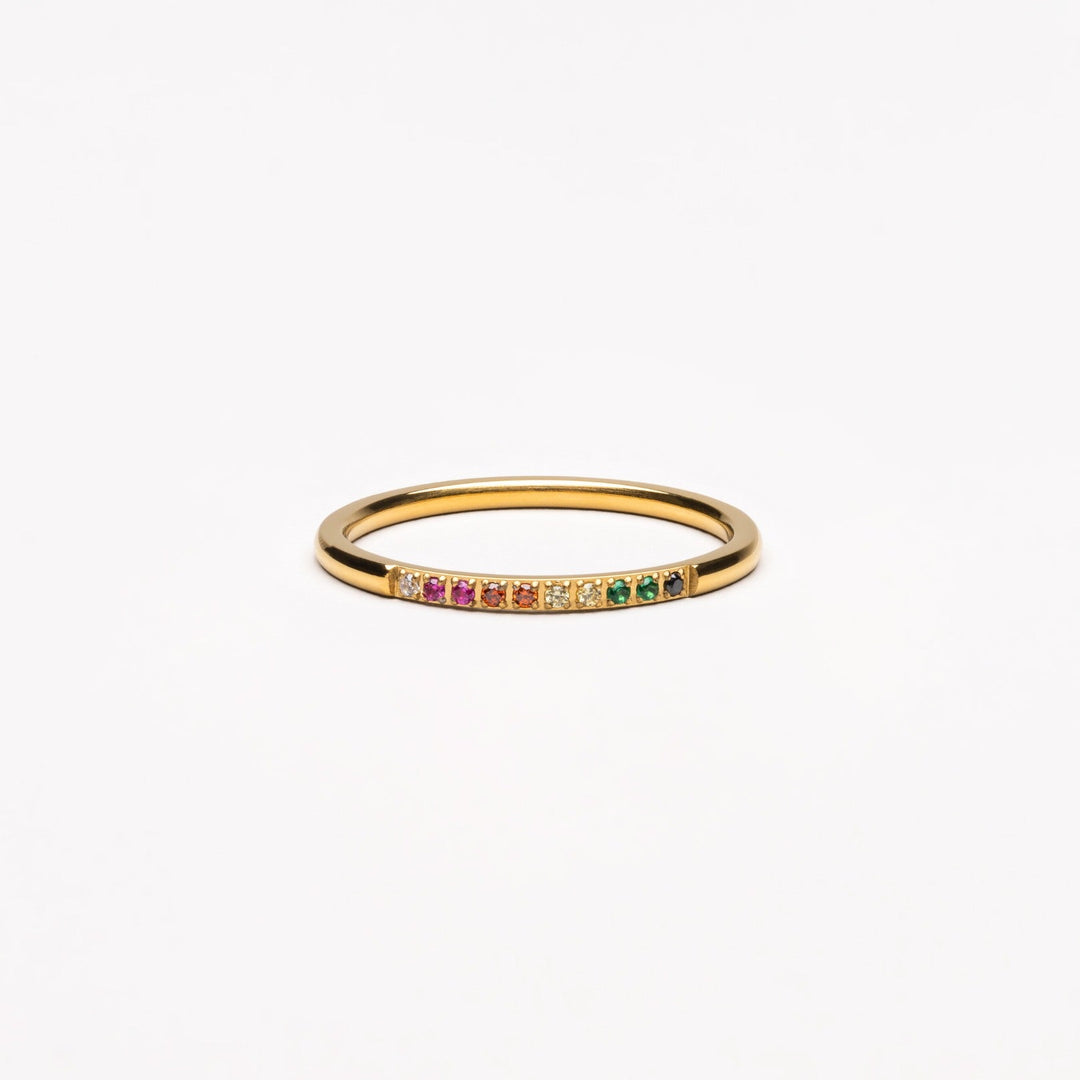 Elegant gold ring for women, adorned with sparkling colorful gemstones. Perfect fashion jewelry.