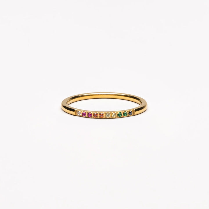 Elegant gold ring for women, adorned with sparkling colorful gemstones. Perfect fashion jewelry.