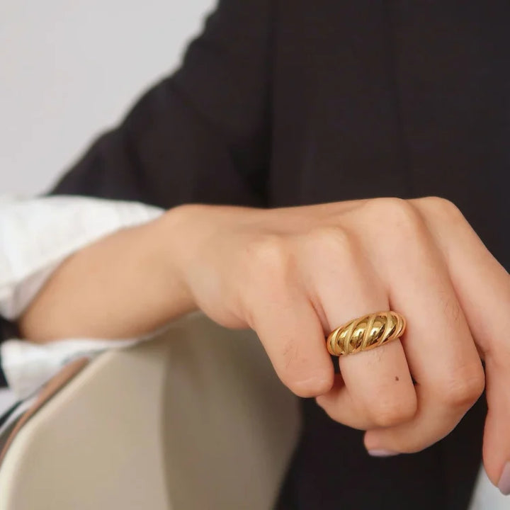 Elegant women's golden rope dome ring. Intricate textured design, perfect fashion gold jewelry statement.