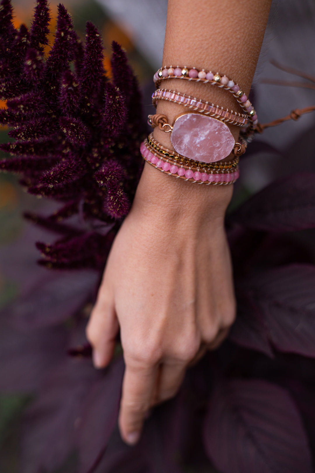 Elegant women's rose quartz and gold beaded bracelet, adjustable fit, ideal for fashion and wellness