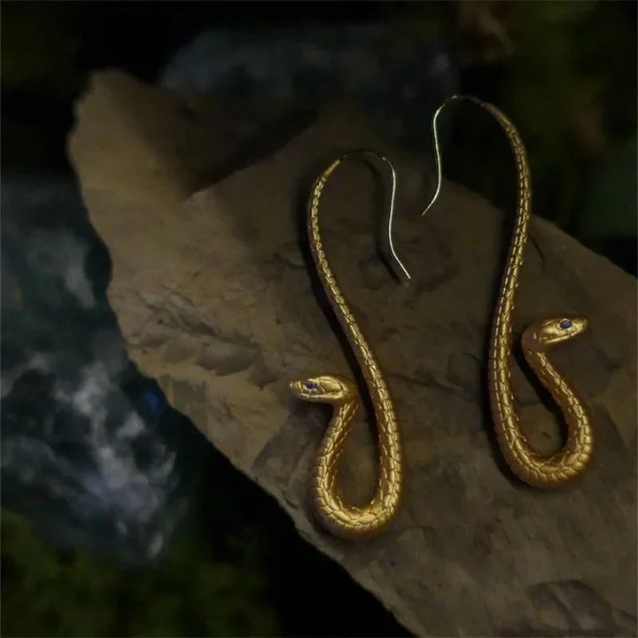 Elegant women's gold snake drop earrings, animal-themed fashion jewelry for a chic and unique look.