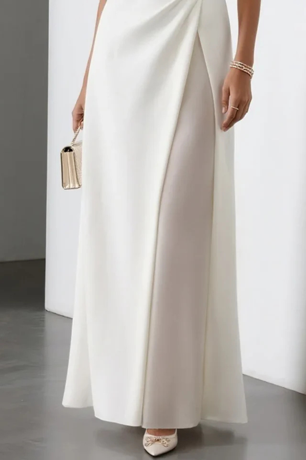 Sleeveless white formal maxi dress for women, ideal as an evening gown or party dress with a graceful side slit.