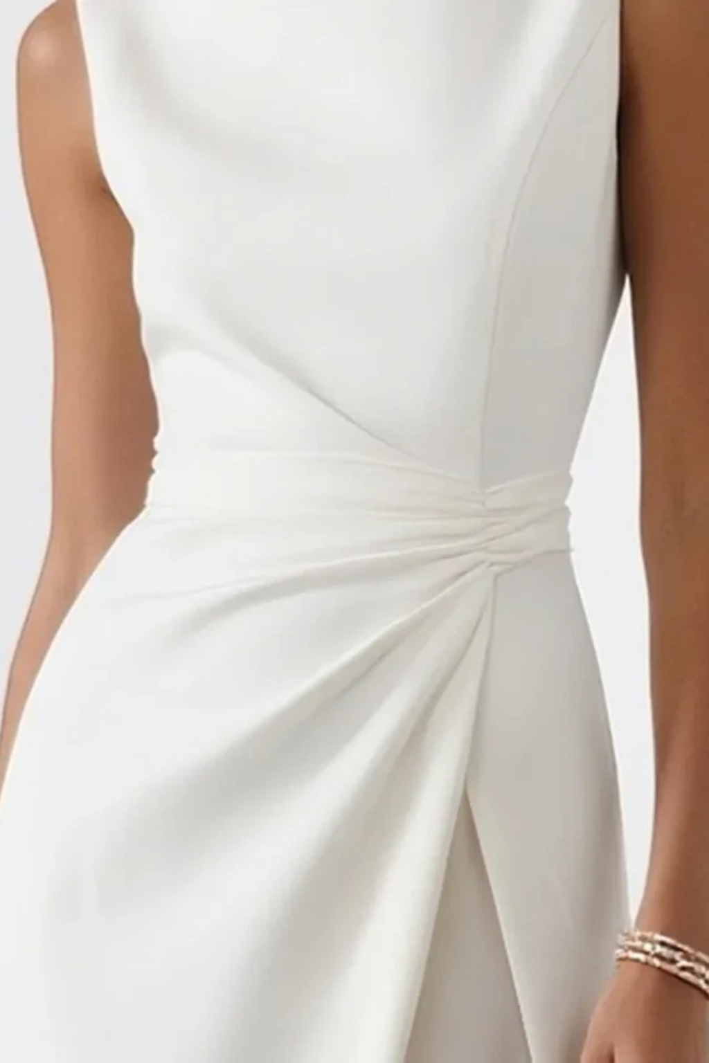 Graceful white sleeveless maxi dress for women, an elegant evening gown with a chic side slit for formal events.