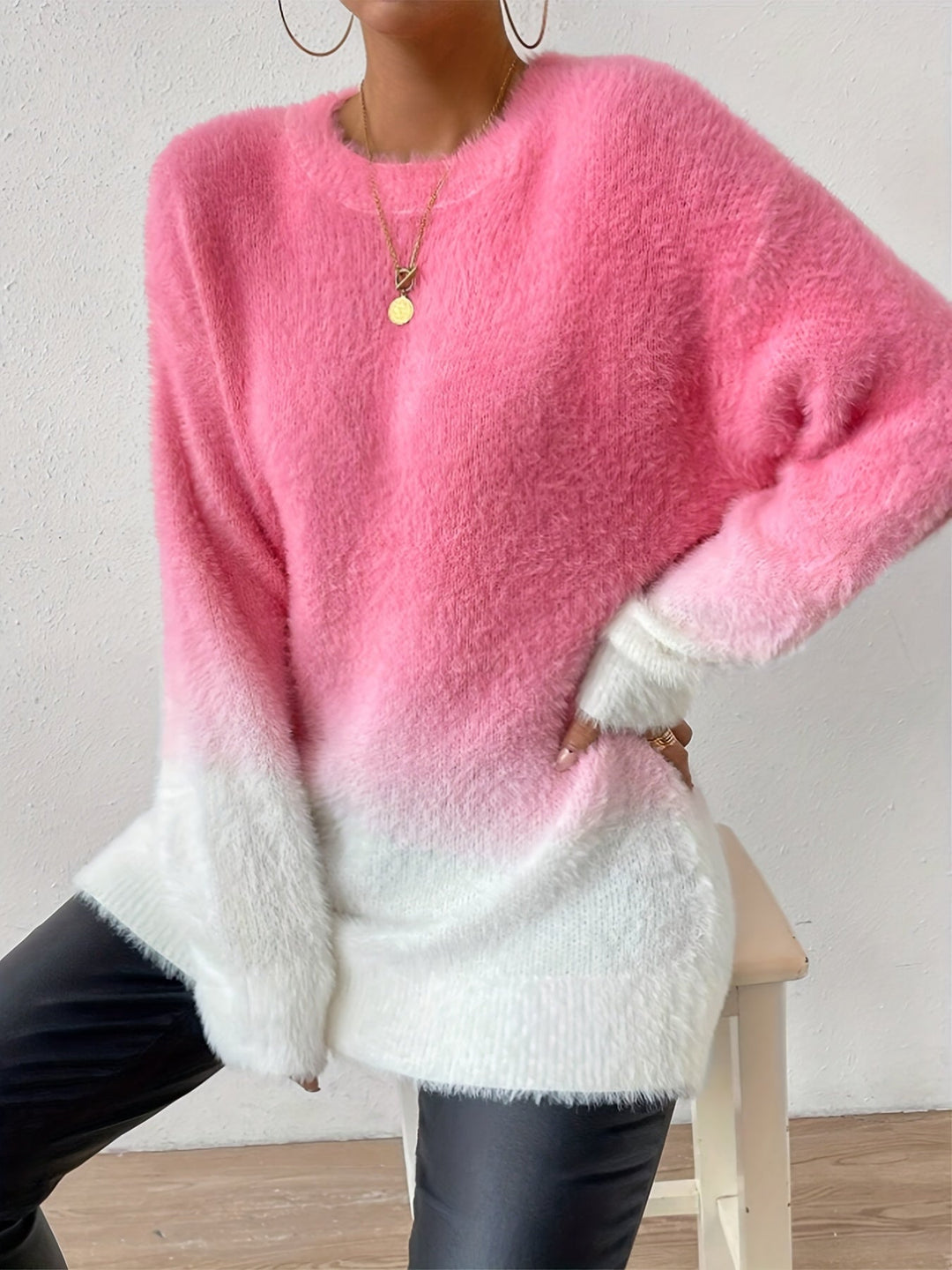 Soft fuzzy crew neck sweater for women, featuring a beautiful graduated pink color. Ideal for cozy casual wear.