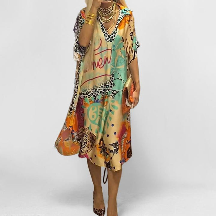 Women's graphic print swing tunic dress with V-neck & short sleeves for effortless spring/summer casual style.