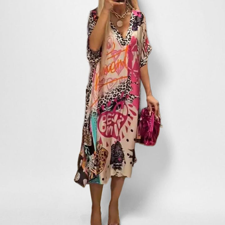 Short sleeve V-neck women's graphic print swing tunic dress. Ideal for stylish spring and summer casual outfits.