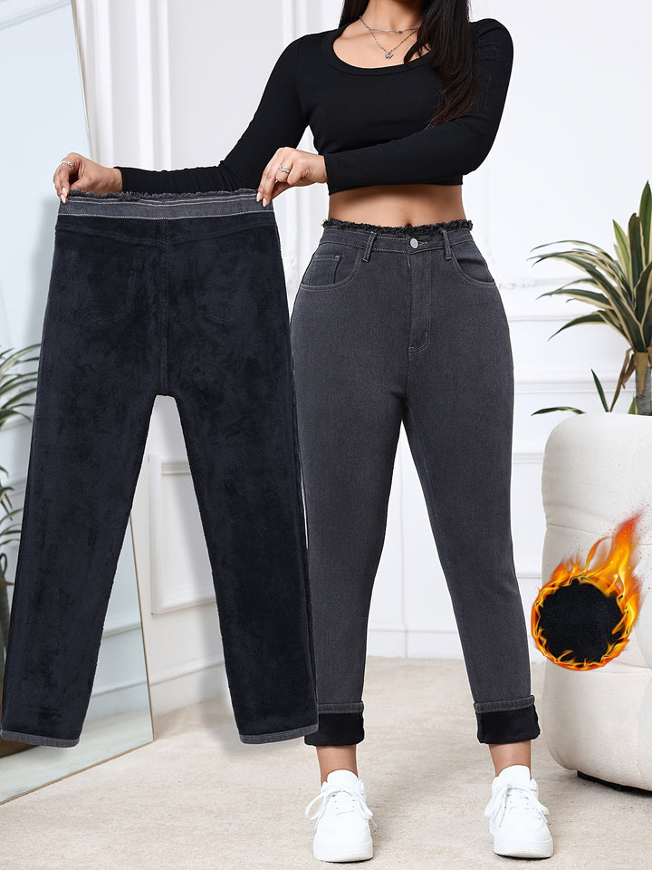 Women's gray fleece-lined skinny jeans, perfect for winter warmth & comfort.